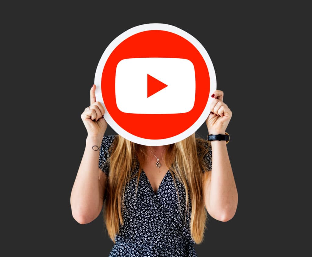 woman holding youtube icon
